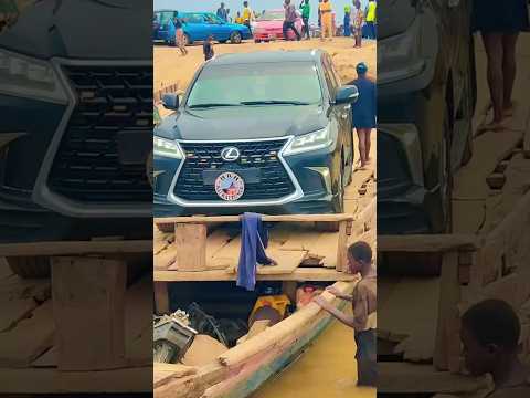 Canoe Transports Vehicles In Convoy Of Nigeria’s First Class Chief, ‘Mai Kaltungo’, Across A River