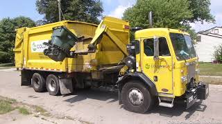 Two newer City of Columbus Garbage Trucks collecting trash after Independence Day 2020