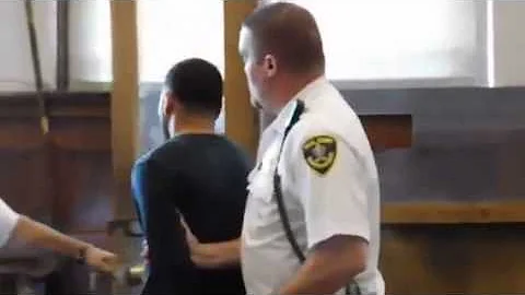 Rodolfo Santiago is taken into custody, held witho...