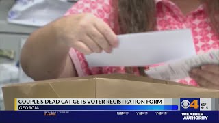 An atlanta family says their dead cat received a voter registration
application.