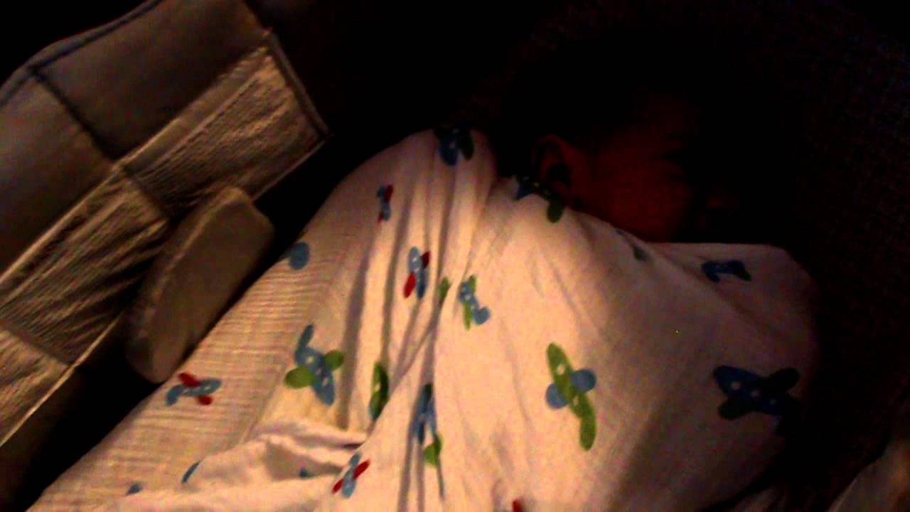 Bambino breaking out of his swaddle YouTube