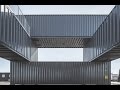 made to be moved worn out shipping containers are stacked three stories high