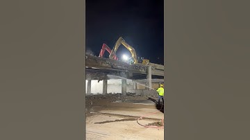 A Group of Excavators Demolishing a Bridge - Unique tools to boost efficiency and streamline work