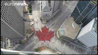 Watch: City creates human maple leaf to mark Canada's 150th birthday
