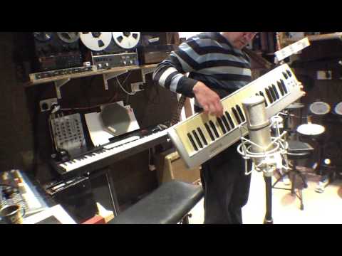 bakerlele---playing-a-bass-with-one-hand-with-keyboards-in-other-hand