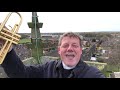 Vicar serenades parishioners with trumpet solo from church roof