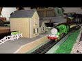 BACHMANN HENRY AND EXPRESS GOING PAST MAITHWAITE STATION. THOMAS AND FRIENDS