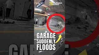 Wall of water gushes into parking garage during typhoon