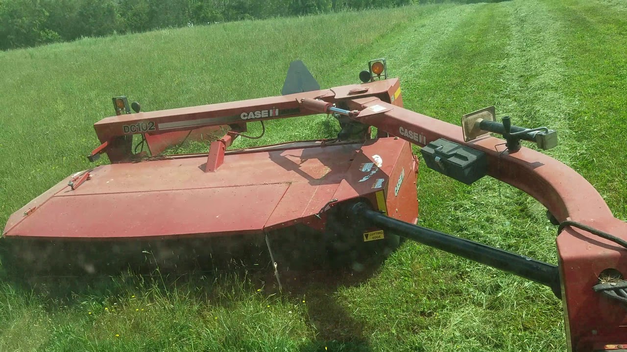 IH 1086 and Case IH DC102 discbine mowing hay YouTube