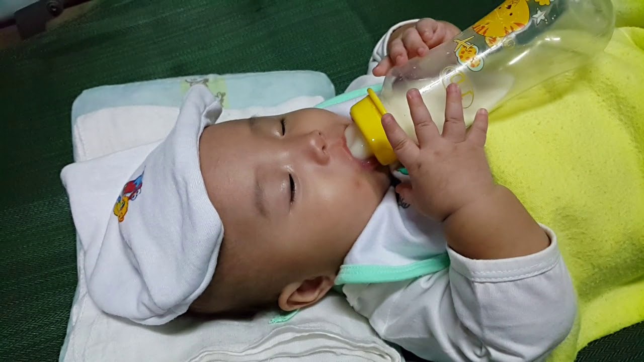 She's sleepy while drinking her milk... YouTube