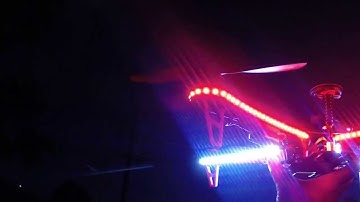 DJI F450 Quadcopter hovering with new lights at night and landind in hand