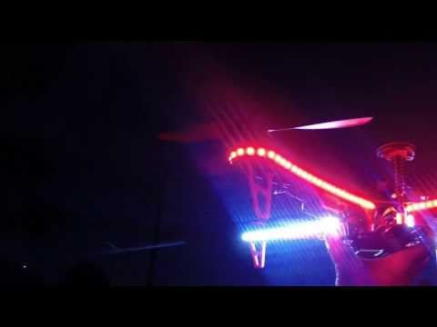 DJI F450 Quadcopter hovering with new lights at night and landind in hand