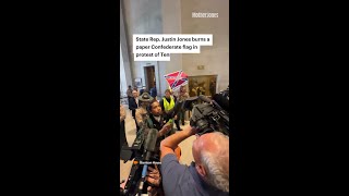 State Rep. Justin Jones Burns a Paper Confederate Flag in Protest