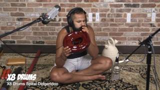 X8 Drums Spiral Didgeridoo
https://www.x8drums.com/aboriginal-spiral-didgeridoo-horn-with-case/
The Spiral Didgeridoo is a unique compact version of a full-length didgeridoo where the internal airflow path on the inside of the instrument is spiral design to allow for the creation of didgeridoo tones.
The spiral shape creates effective length of 42 due to the internal airflow path. The mouthpiece is sanded smooth so there is no need for a wax mouthpiece and the mahogany wood construction facilitates rich sounds. X8 Drums Spiral Didgeridoo