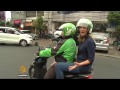 Motorbike app shakes up traditions in indonesia