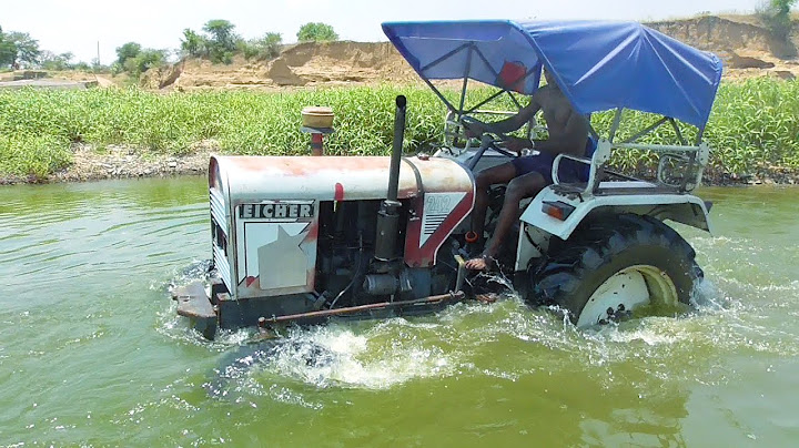 Washing my Eicher 242 Tractor in River