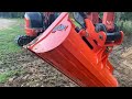 AMI tilt grade bucket cutting the first swale & installing it