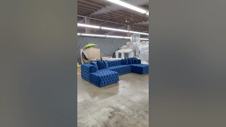 Soho tufted sectional in navy blue velvet