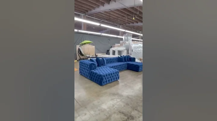 Soho tufted sectional in navy blue velvet