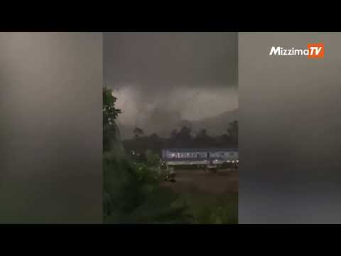 Dark skies and swirling debris as tornado hits Guangzhou, China