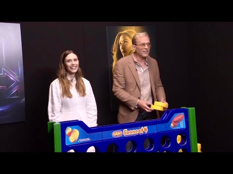 Elizabeth Olsen and Paul Bettany play Connect 4