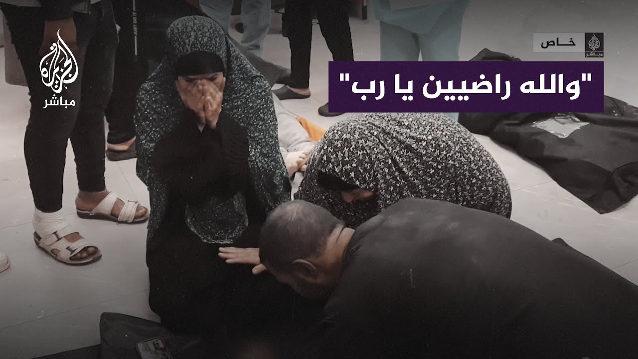 فلسطينية تودع طفليها شهيدين إثر قصف إسرائيلي