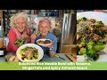 Balanced rice noodle bowl with sesame gingertofu and spicy almond sauce