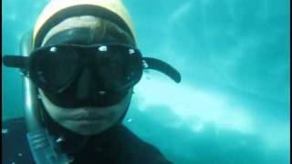 Freediving under an iceberg. Greenland