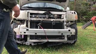 Installing a bumper cover on the wrecked Scion XB that hit a deer!