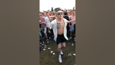 Shirtless Man Faceplants While Doing Backflip Amidst Crowd - 1081884