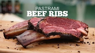 Pastrami beef ribs on a wooden cutting board, showcasing juicy meat texture, relevant to grilling recipes for Green Mountain Grills.