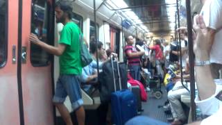 Street musicians sing in Madrid metro train