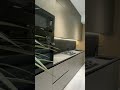 Laminated kitchen with dark tone and semi finished