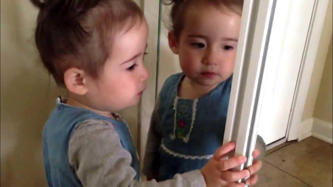Toddler girl caught kissing self in mirror YouTube