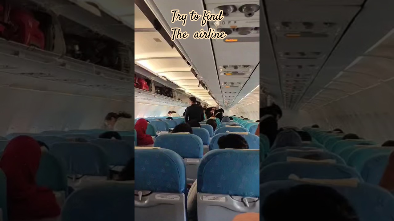 Try to find the airline by its seat colour and crew uniform 