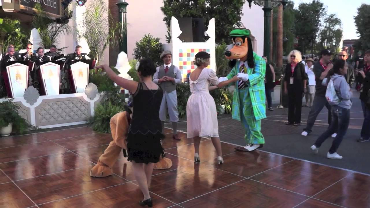 Goofy and Pluto swing dancing at the opening of Buena Vista Street at Disney California Adventure