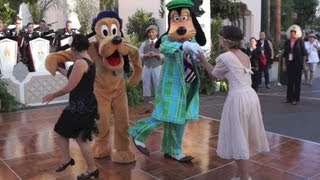 Goofy and Pluto swing dancing at the opening of Buena Vista Street at Disney California Adventure