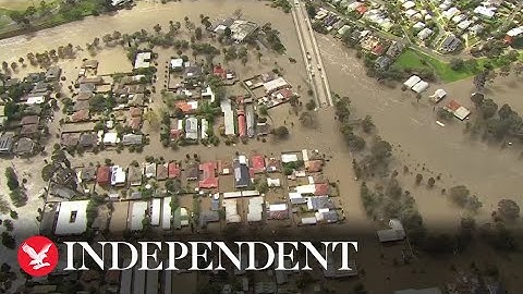 Houses surrounded by water as floods inundate Australia