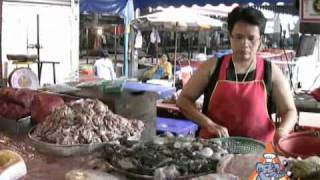 Thai Street Vendor Prepares Pla Chon Fish