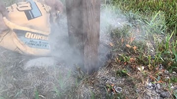 Setting fence post straight and level.