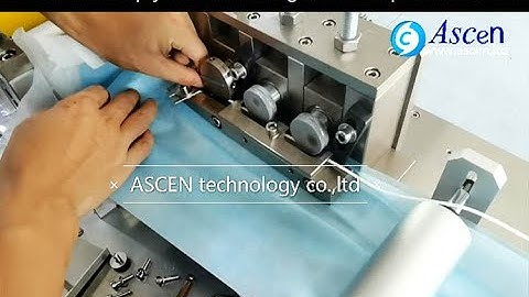 load fabrics and adjust 3 ply medical mask making machine to solve fault in mask production line