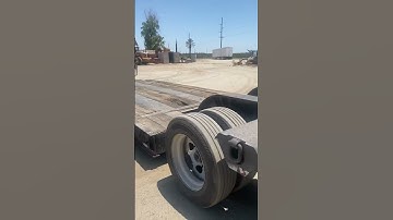 Massive Grinder machine getting loaded on trailer lowboy trailer heavy haul Sounds like a helicopter