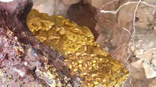 MAN DUG A HOLE ABOVE A GOLD LAYER