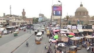 Iraqis react to government’s decision to adjust the exchange rate of the dinar against the US dollar Update