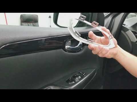 Vídeo: Com treure el panell de la porta en un Nissan Sentra?