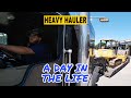 A day in the life of a heavy haul trucker | kenworth picking up dozer and roller from auction
