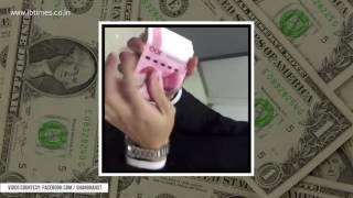 Watch how this guy counts his fat stack of cash. His technique will surely leave you awe-struck