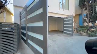 Information A Dynamic, Automatic Modern Architectural Out-Swing Carriage Door System in Anodized Aluminum Finish News