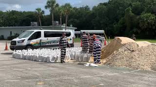 Sheriff's Inmate Work Crew Fills Sandbags for Residents in Preparation for Hurricane Isaias