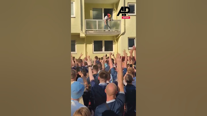 German fan drops bottles of beer to Scottish supporters from balcony in Cologne #germany #cologne